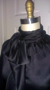 neck bow detail of silk blouse